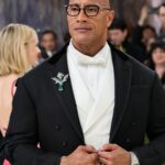 Dwayne Johnson in a black tuxedo and white bow tie at the Met Gala.